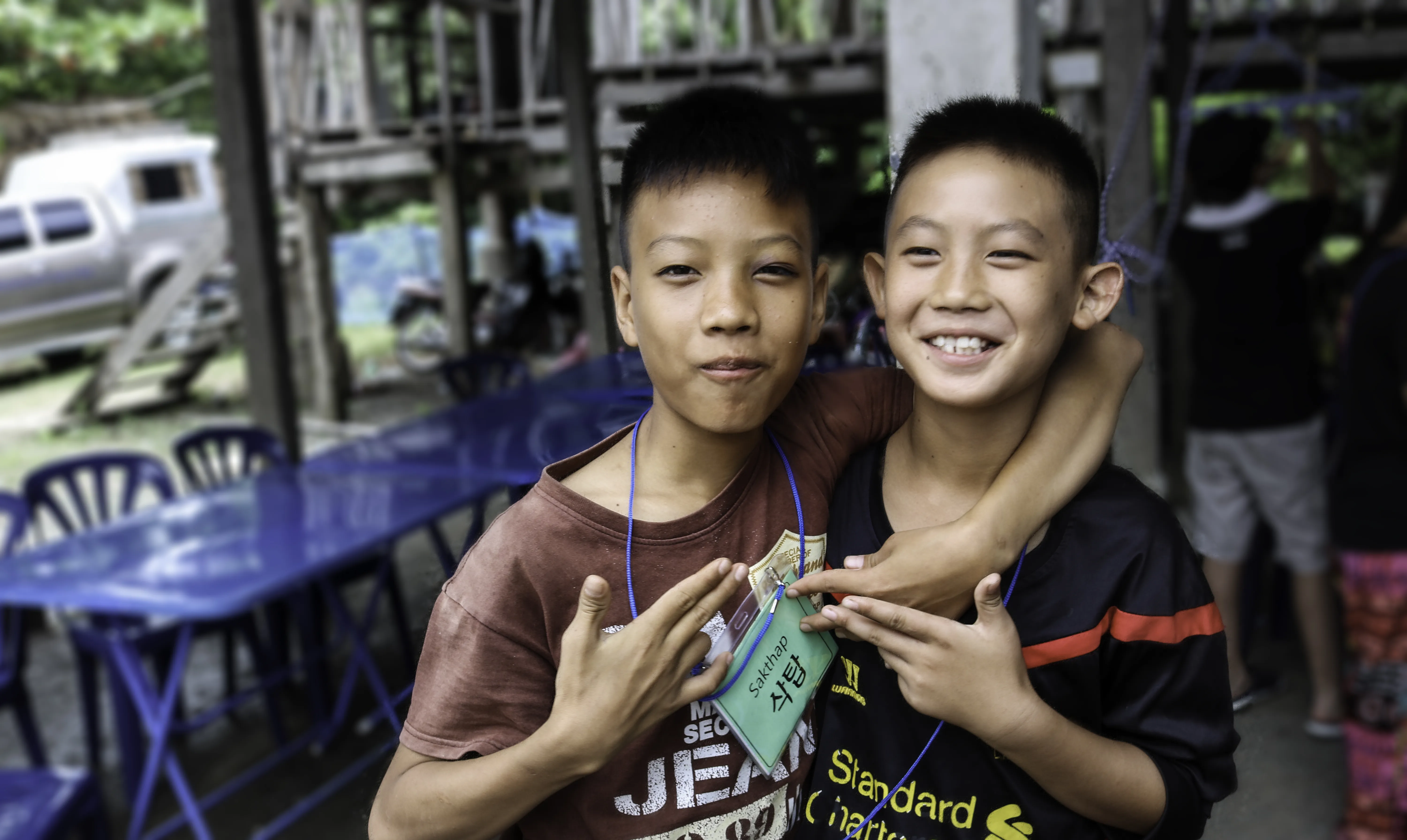 Two boys smiling together at the foundation